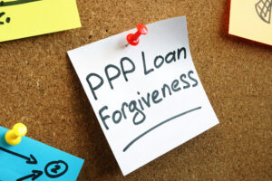 PPP loan forgiveness memo on the board.
